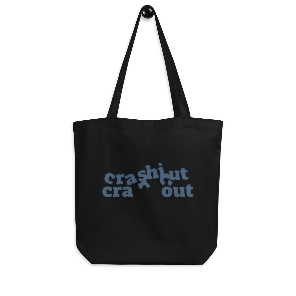 Black 'crash out' organic canvas tote bag hanging on a hook, text-only design with just the words crash out, cozy bluesky