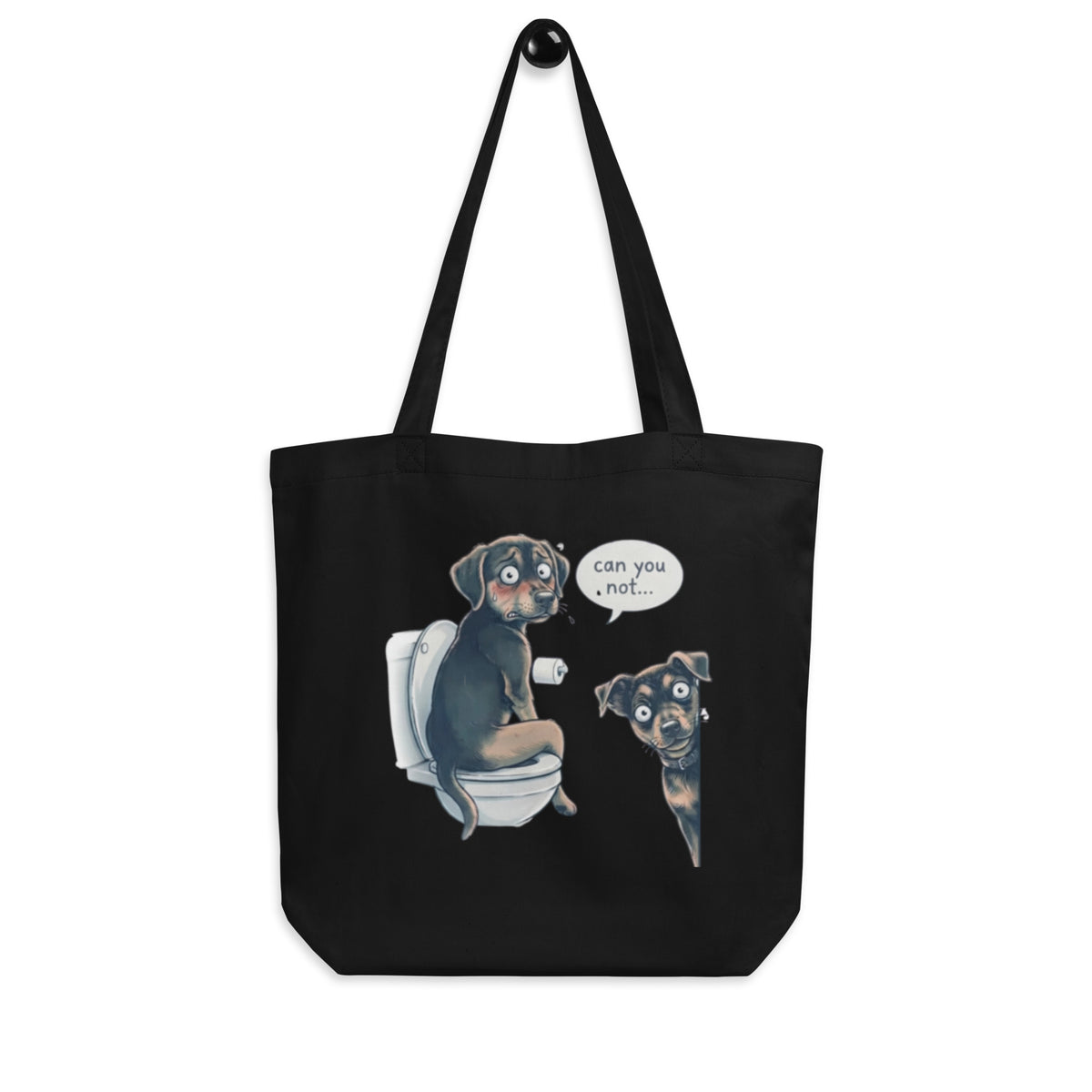 Black 'can you not?' organic canvas tote bag hanging on a hook, dog peeking through a bathroom door, cozy bluesky