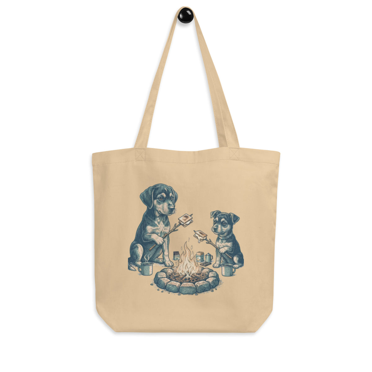 Oyster 'the s'mores' organic canvas tote bag hanging on a hook, two puppies roasting s'mores at a campfire, cozy bluesky